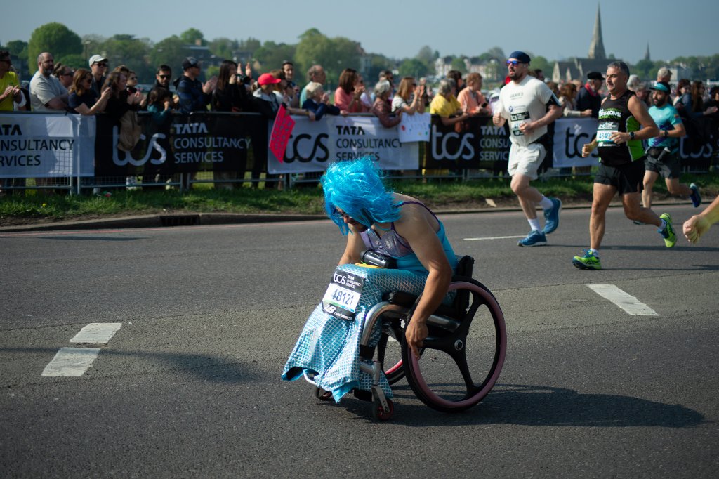 Runner with white sunglasses racing through Blackheath