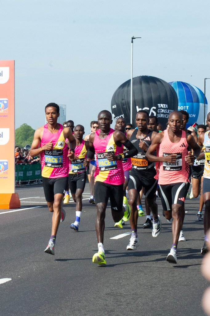 Runners in inflatable sumo and ballerina costumes
