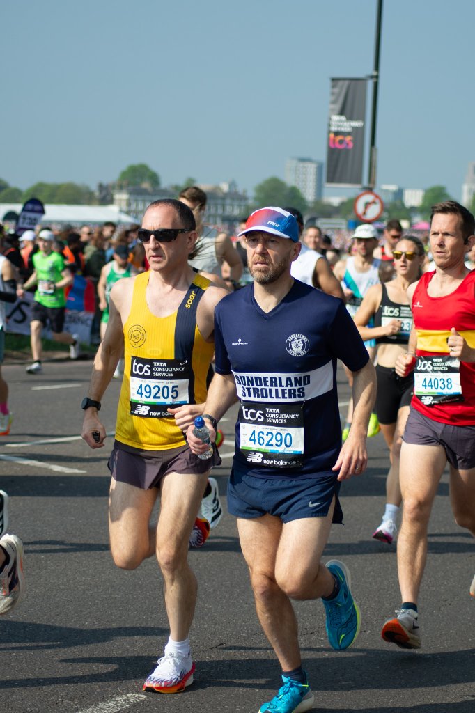 Runner taking a selfie with race bib 13680